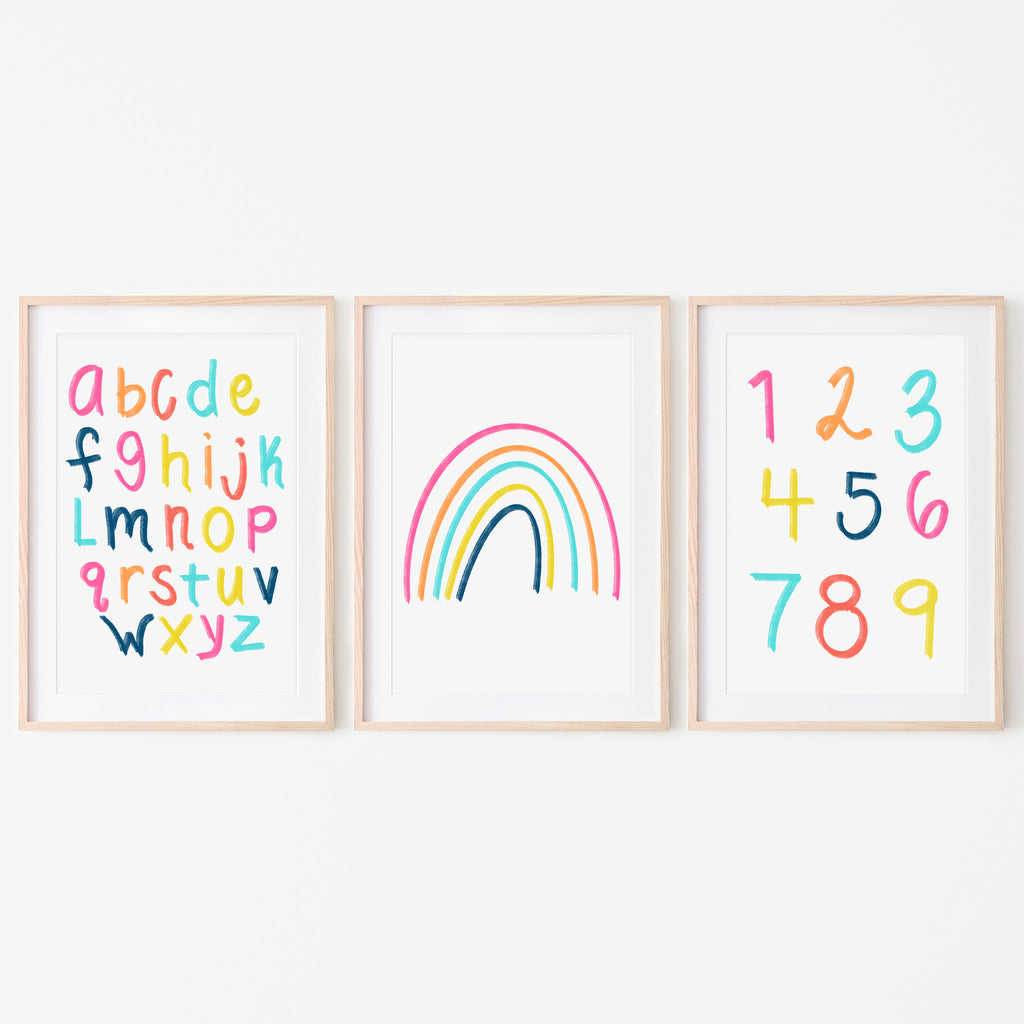 Bight and colorful art prints. First one is the alphabet in bight colors, second one is a brightly colored rainbow, and the third one is the numbers 1-9 in bright colors. They are all on a white background. These prints were designed to be in a nursery, playroom, classroom, or daycare center. Gift idea.