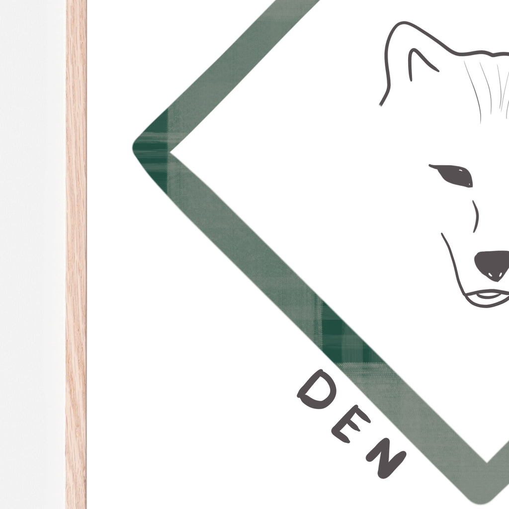 Close up image of A drawing of a fox with a green triangle around it. The words 'den leader' are underneath and it is on a white background with a wood frame. This print is designed to go in a baby room, nursery, kids bedroom, playroom, classroom, or daycare center. Gift idea.