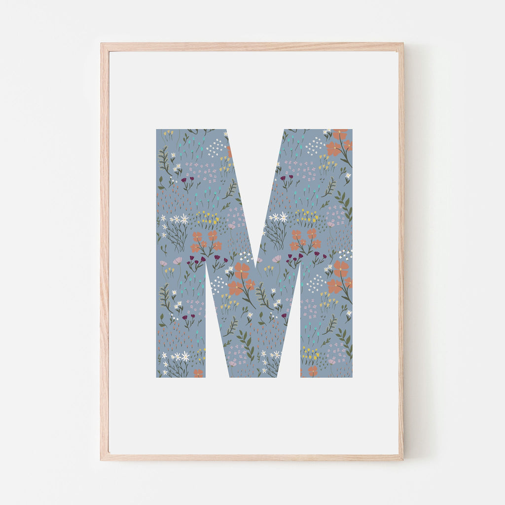 Blue floral print inside of the letter M with all white background and wood frame. Art print for kids bedrooms, playrooms, shared sibling spaces, classrooms, daycares and more. Gift idea.