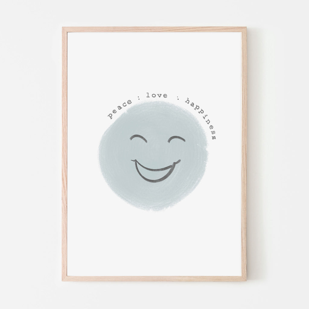 Blue smiling face with the words peace love and happiness above it with a white background