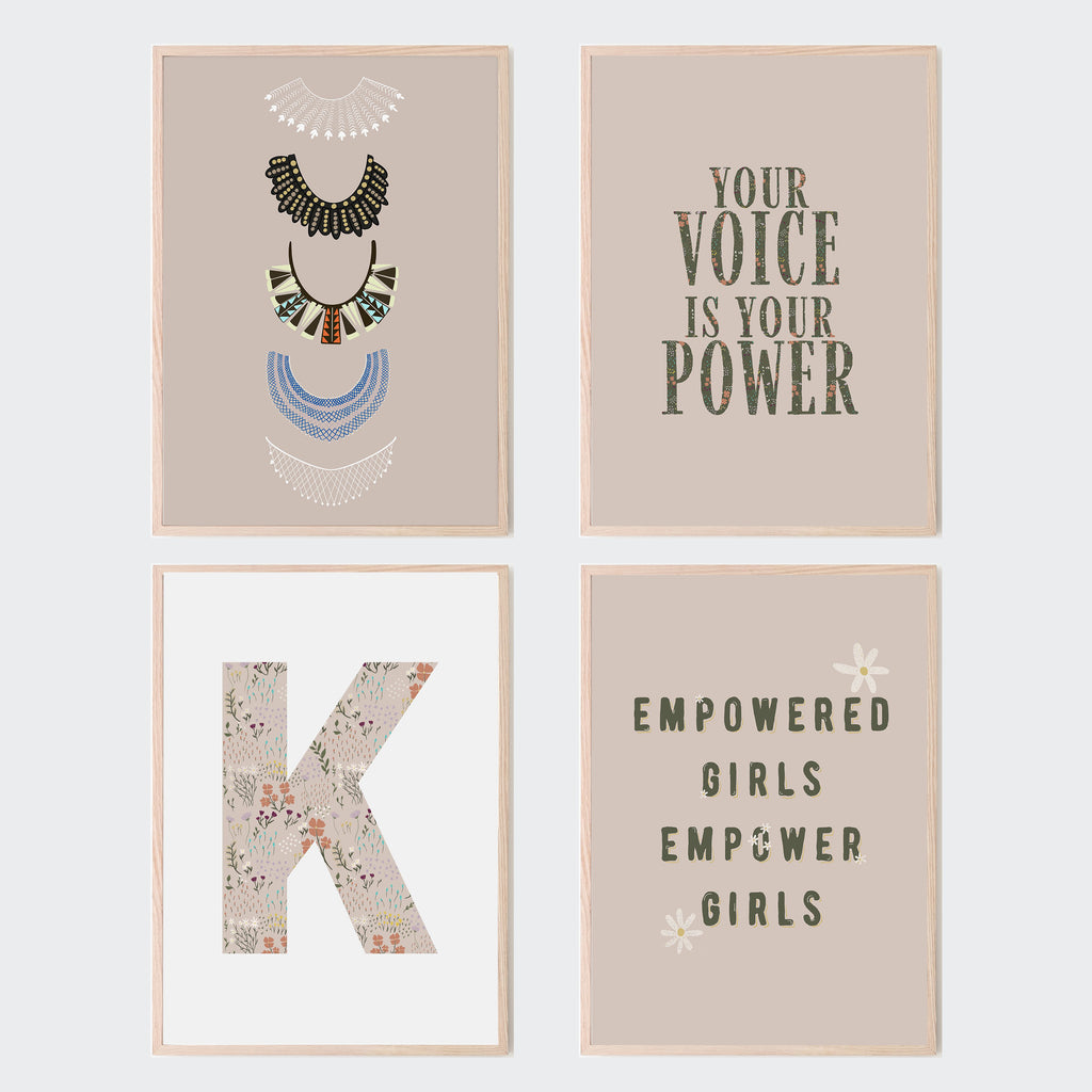 The first prints reads Your voice is your power. The second is Ruth Bader Ginsburg's five collars and jabots. The third print is a large floral letter K. The fourth reads 'Empowered girls empower girls' in green lettering. Set of 4 cream prints for nursery, playroom, classroom, living room, and bedroom.
