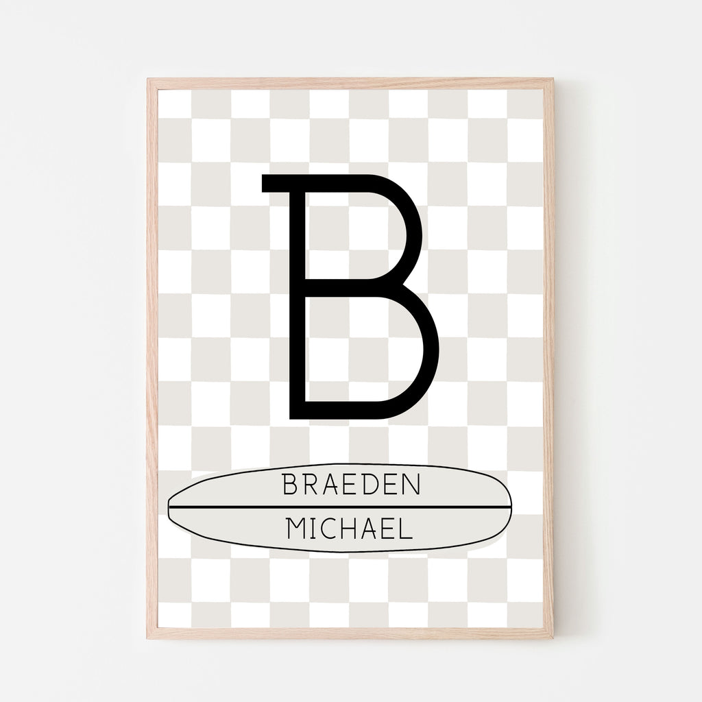 Cream and white checkered background with a large letter and child's first and middle name on a horizontal longboard surfboard. Personalized name sign for baby nursery room, kids bedroom and playroom