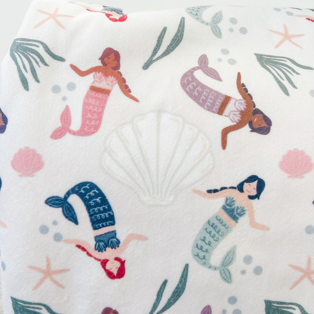 Diverse mermaid baby blanket with seashells, seaweed and bubbles