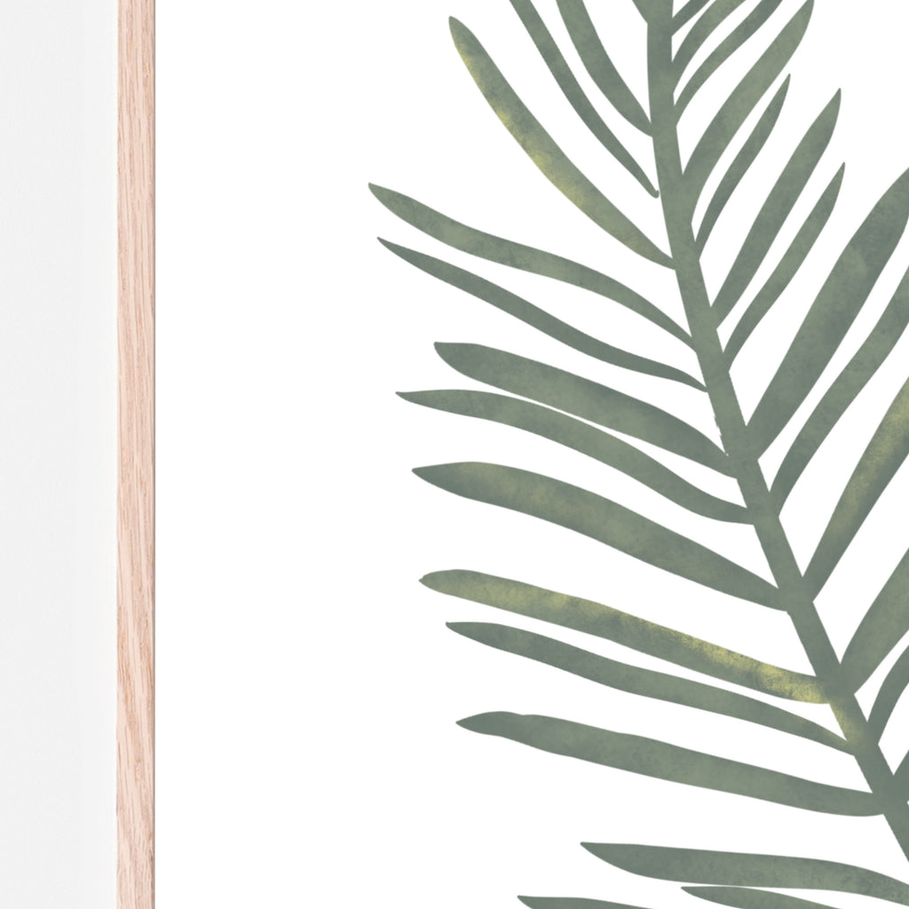 Hand drawn safari green palm leaf print. Art print is on a white background in a wood frame. Print designed for bedrooms, nurseries, classroom, daycares, and living rooms. Gift idea.