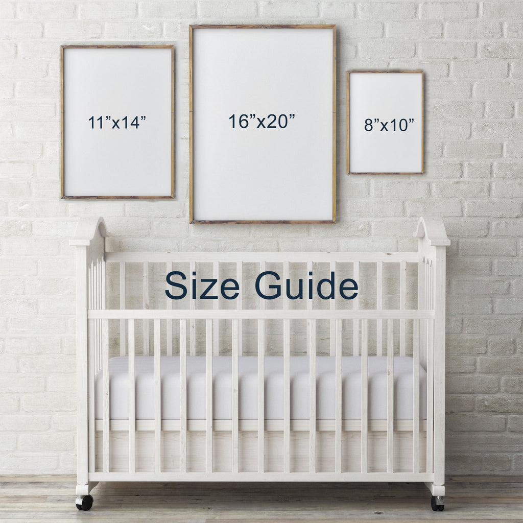 Art print size guide over baby nursery crib